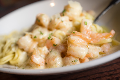 Fresh Italian shrimp scampi with shaved parmesan cheese