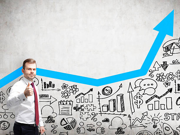 istock Thumbs up businessman with blue arrow 618444310