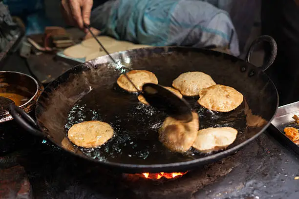 Cooking Puris In Backstreet Of Varanasi,India.The photo is shot with a full frame DSLR camera in horizontal composition.