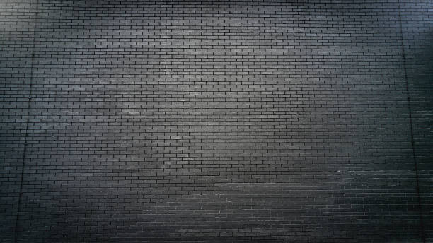 istock Toned photo of black brick wall 618446442