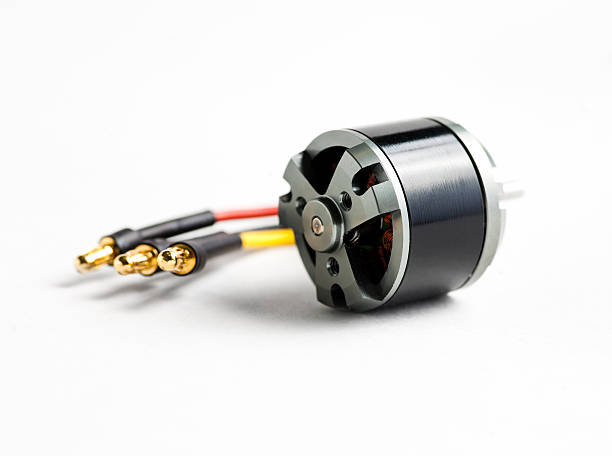 istock Small electric motor and wires on white 618448248