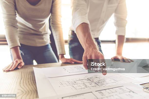 Business Couple Working Stock Photo - Download Image Now - Architect, Couple - Relationship, Examining