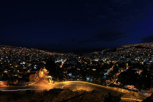 Panorama of night La Paz, Bolivia, Illimani mountain in the Background