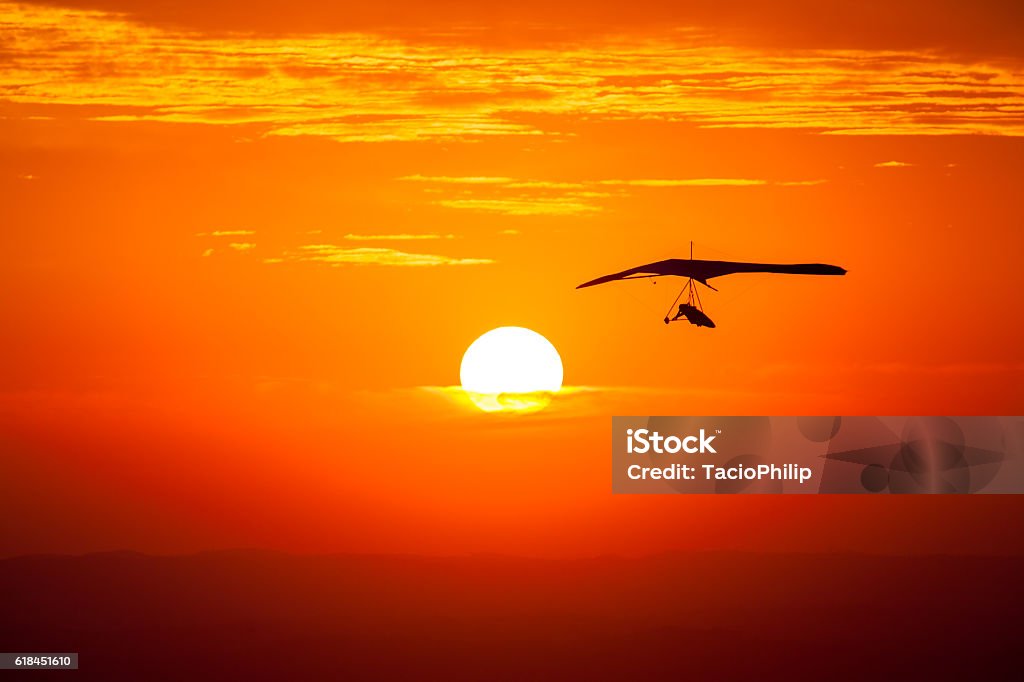 Hang gliding in the sunset Hang-gliding Stock Photo