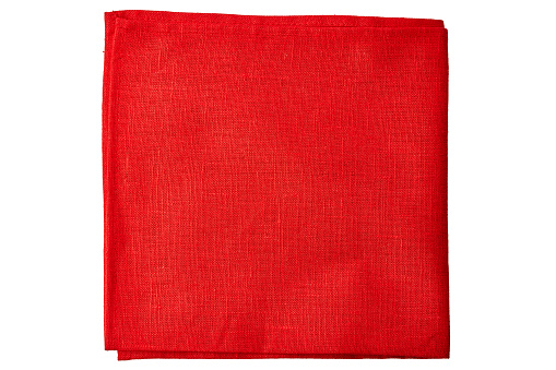 Red fabric napkin isolated on white background