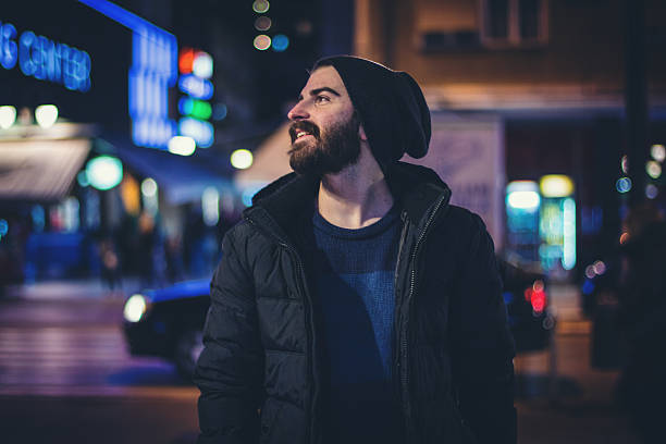 istock Happy bearded man in the city at night 618452516