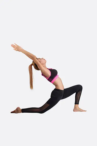 Photo of Young woman in yoga pose.