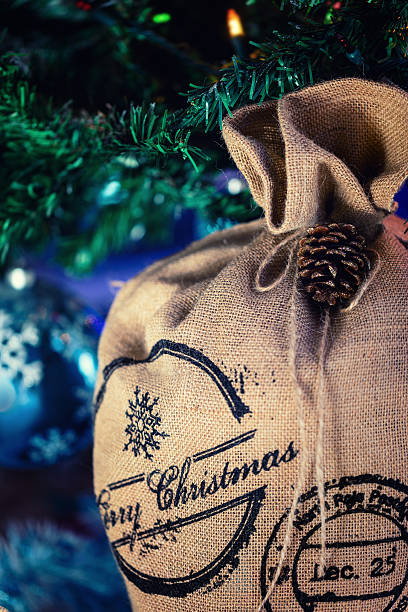 istock Santa Claus Bag under Christmas tree, Xmas festive background 618453984