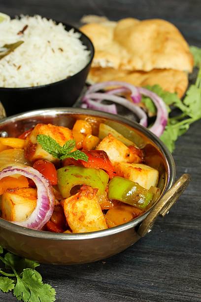 istock Kadai Paneer served with rice and Bhatura 618455184