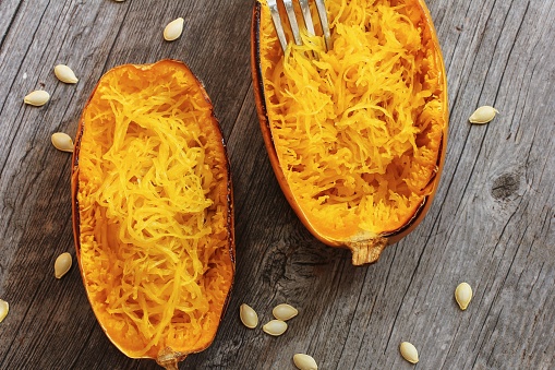 Spaghetti squash with bacon and spring onion topping top down view