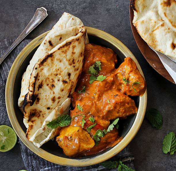 istock Butter Chicken served with homemade Indian Naan bread 618457116