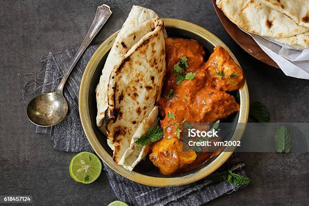 Butter Chicken Served With Homemade Indian Naan Bread Stock Photo - Download Image Now