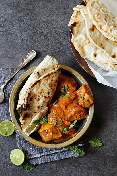 istock Butter Chicken served with homemade Indian Naan bread 618457146