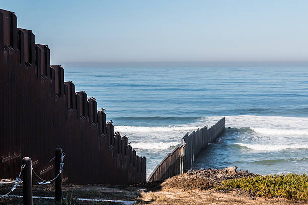 istock International Border Wall Extending Out Into The Pacific Ocean 618458732