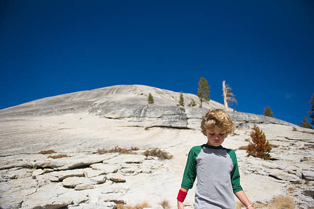 A child hiking in Tuolumne meadows, Ca