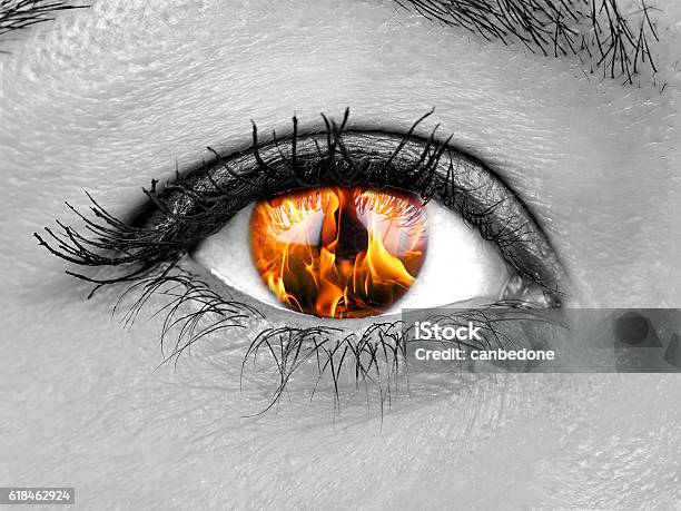 Closeup Female Eye Iris Burning Stock Photo - Download Image Now - Fire - Natural Phenomenon, Eye, Women