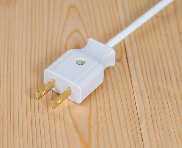 istock electric plug on wooden 618463408