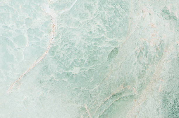 istock Closeup green marble stone floor texture background 618463718