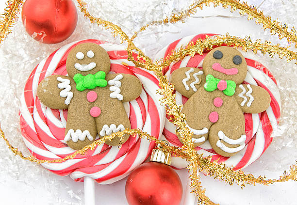 istock Gingerbread man Christmas lollipops closeup 618464084