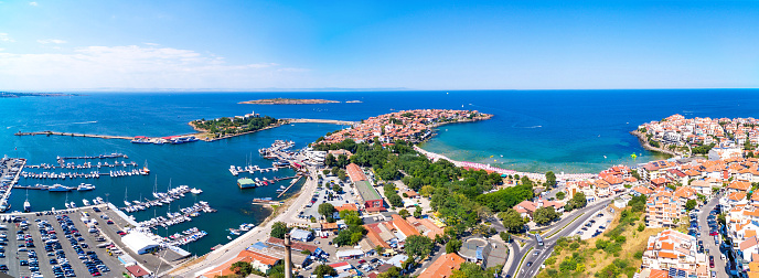 Panoramic view of  Sozopol, Bulgaria. Houses, roads and vehicles, old ruins on rocks.