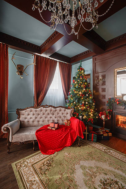 istock Christmas morning. classic apartments with a white fireplace, decorated tree 618465704