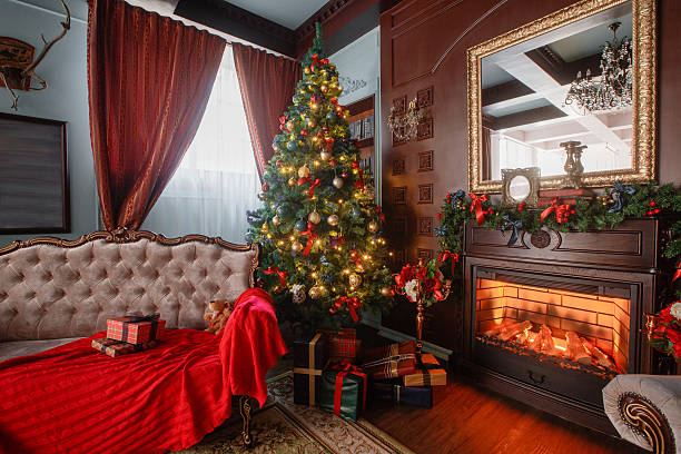 istock Christmas morning. classic apartments with a white fireplace, decorated tree 618465810