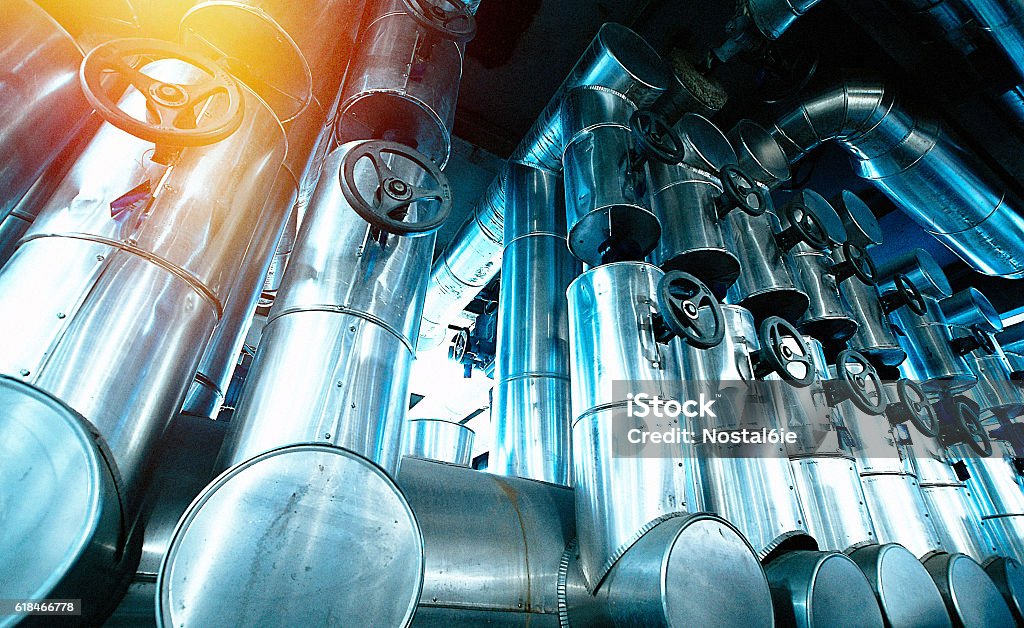 Industrial zone, Steel pipelines and cables in blue tones Nuclear Power Station Stock Photo