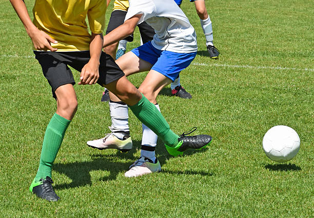 istock Children are playing soccer 618510376