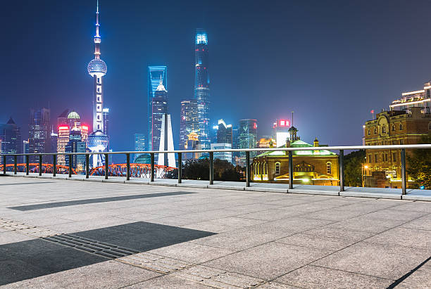 istock footbridge with cityscape at night 618510440