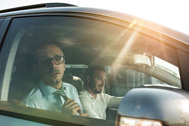 istock Adjusting the tie in the car! 618510894