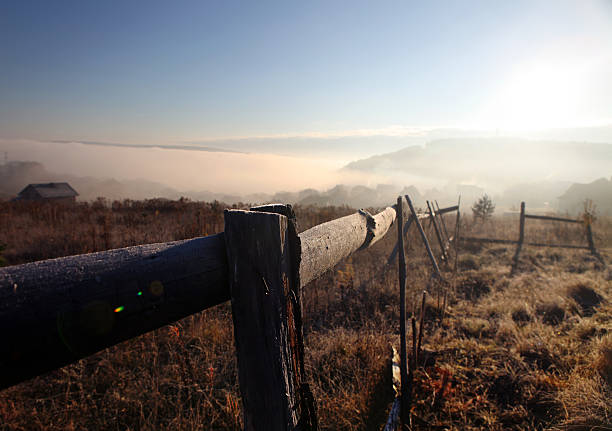 istock sunrise with fog over field 618514918