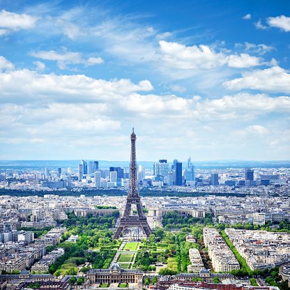 Aerial view of Paris with Champ-de-Mars, Eiffel Tower and skyscrapers of La Defense. Composite photo