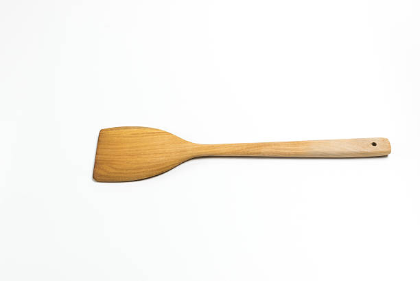 istock Wooden flipper or spade isolated on white background 618516216