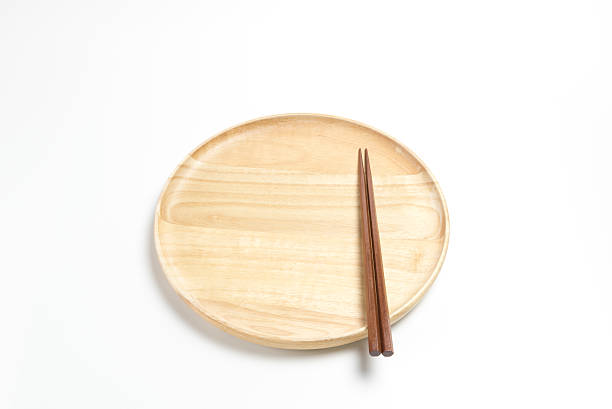 istock Wooden plate or tray with chopsticks isolated on white background 618516512