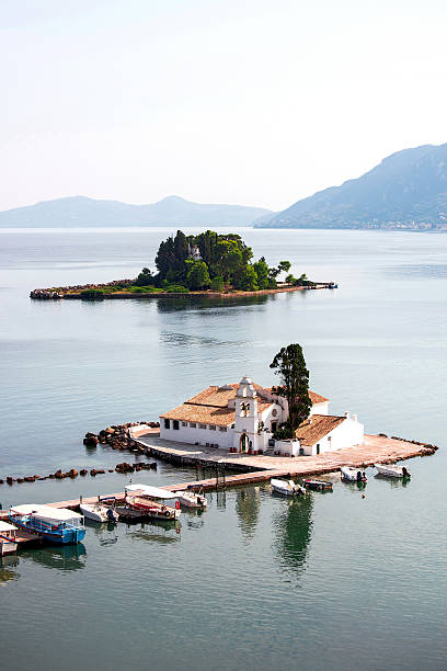 Pontikonisi and Vlacheraina monastery seen from Kanoni in Corfu, Greece.