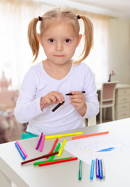 istock The girl draws with markers 618518438