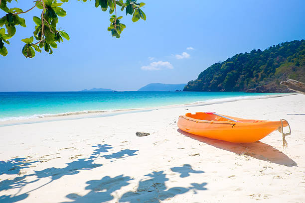 istock Yellow kayak on the white beach 618522558