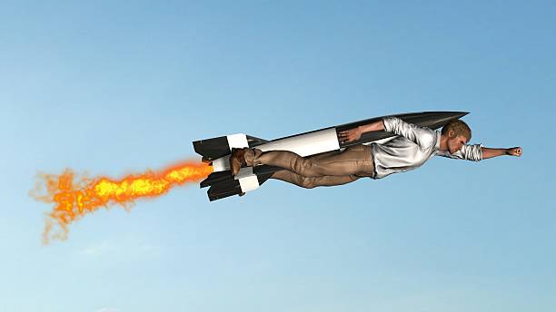 istock man flying with jet pack rocket in the sky 618522696