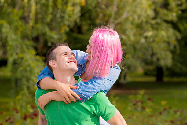 istock Young couple having fun in countryside 618523148