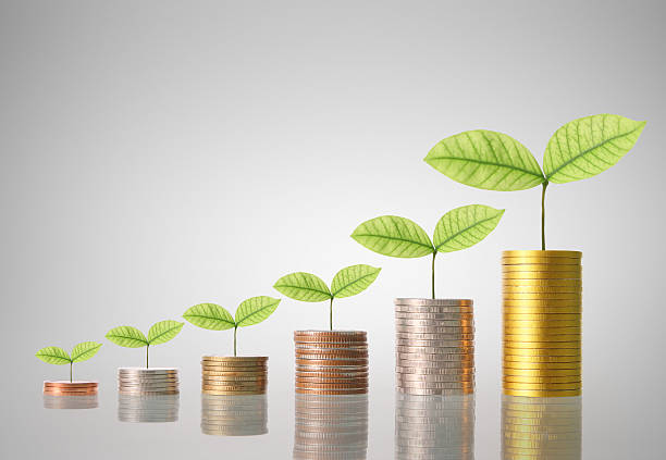 istock Coins graph stock market 618523160