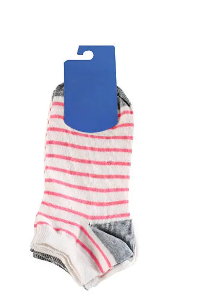 Pair of striped socks with blank label, isolated on white background