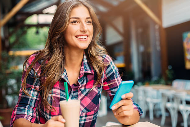 istock Woman texting at the cafe 618523836