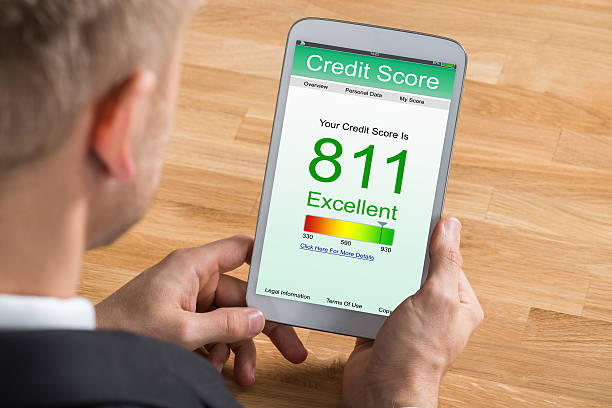 istock Businessman With Digital Tablet Showing Credit Score 618523876
