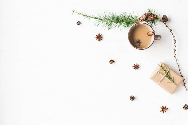 istock Christmas. Cup of coffee, larch branches, cinnamon sticks, anise star 618524738
