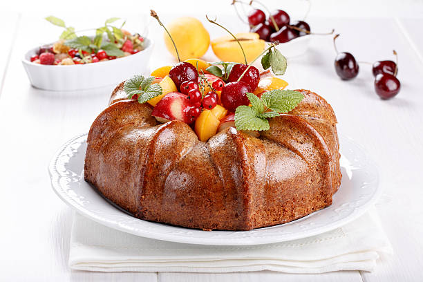istock Naked cake derorated fresh fruit and berries 618525450