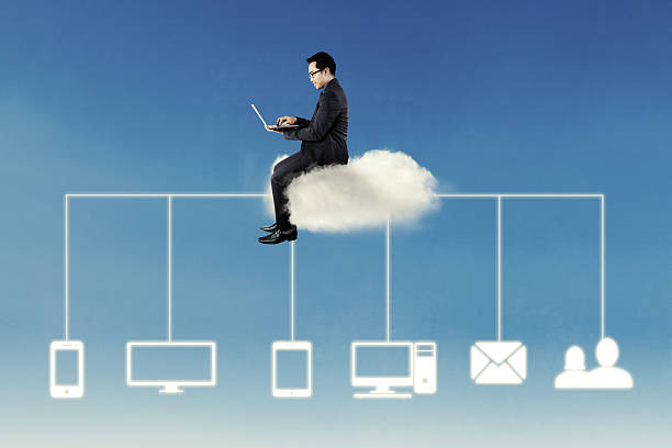 istock Businessman works on cloud with laptop 618526742