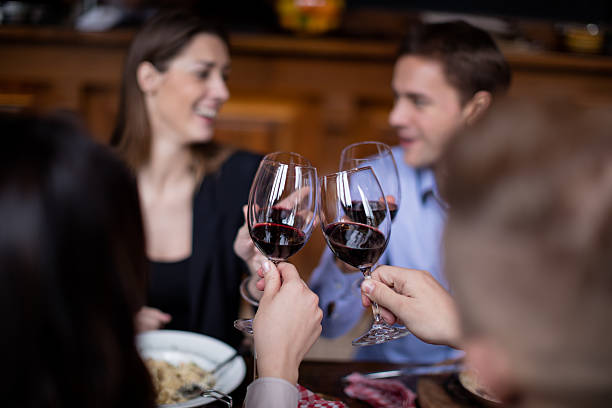 istock Friends toasting with wine glasses 618527974
