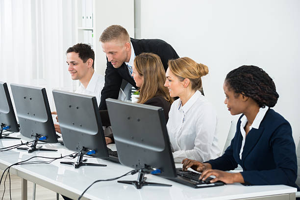 istock Businessman Helping His Colleagues In The Office 618529168