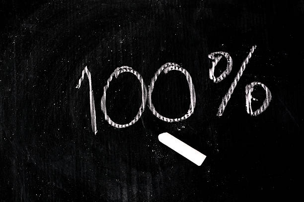 istock 100-percent title written with a chalk 618529516