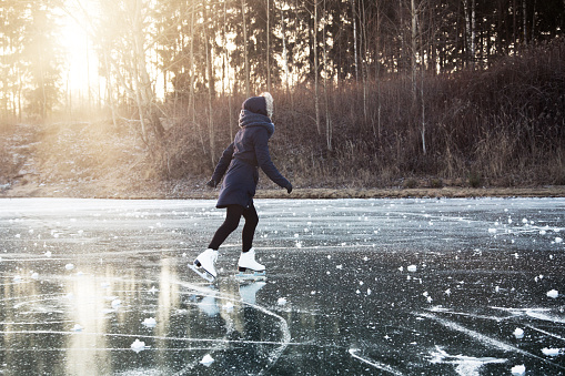Ice skating on the frozen lake